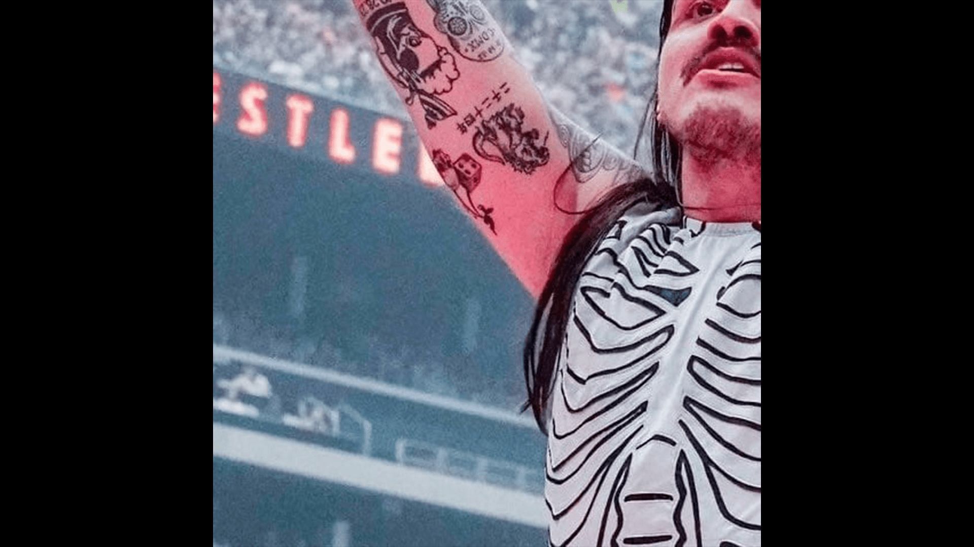 Dominik Mysterio's new tattoo! (Credit: Netflix broadcast of WWE WrestleMania)